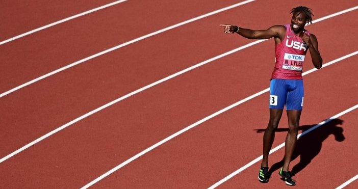 Noah Lyles competing in a track race.