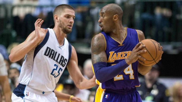 Chandler Parsons of the Dallas Mavericks facing off against Kobe Bryant during an NBA career game.