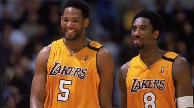 Robert Horry holding a Kobe Bryant jersey
