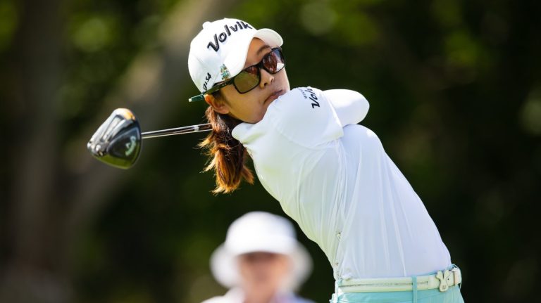 Mi Hyang Lee, LPGA golfer, swings on the course.