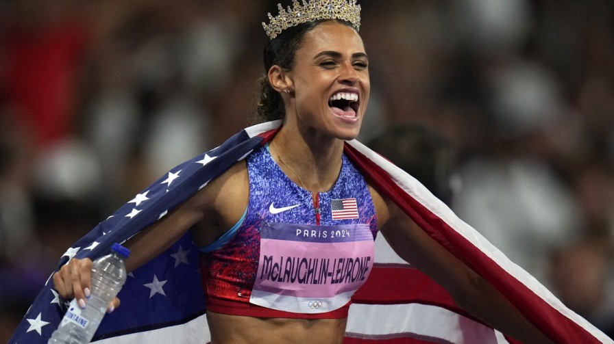 Sydney McLaughlin-Levrone celebrates after achieving an Olympic goal in track and field.